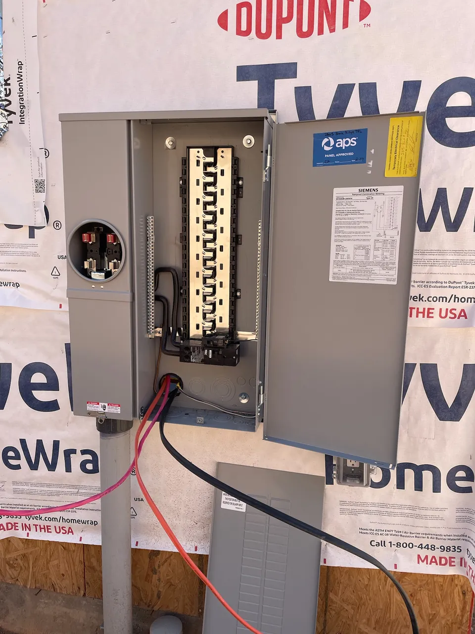 New meter main combination service entrance mounted on an exterior wall