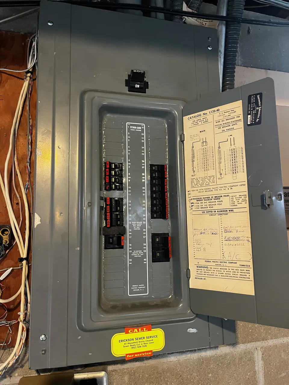 Square D electrical panel with the cover open and a filled-out circuit directory